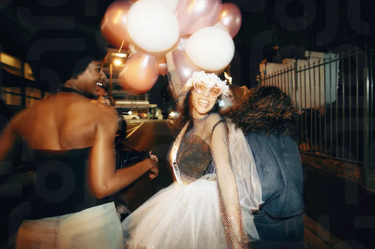 Bachelorette party group celebrating with balloons on a night out in Austin