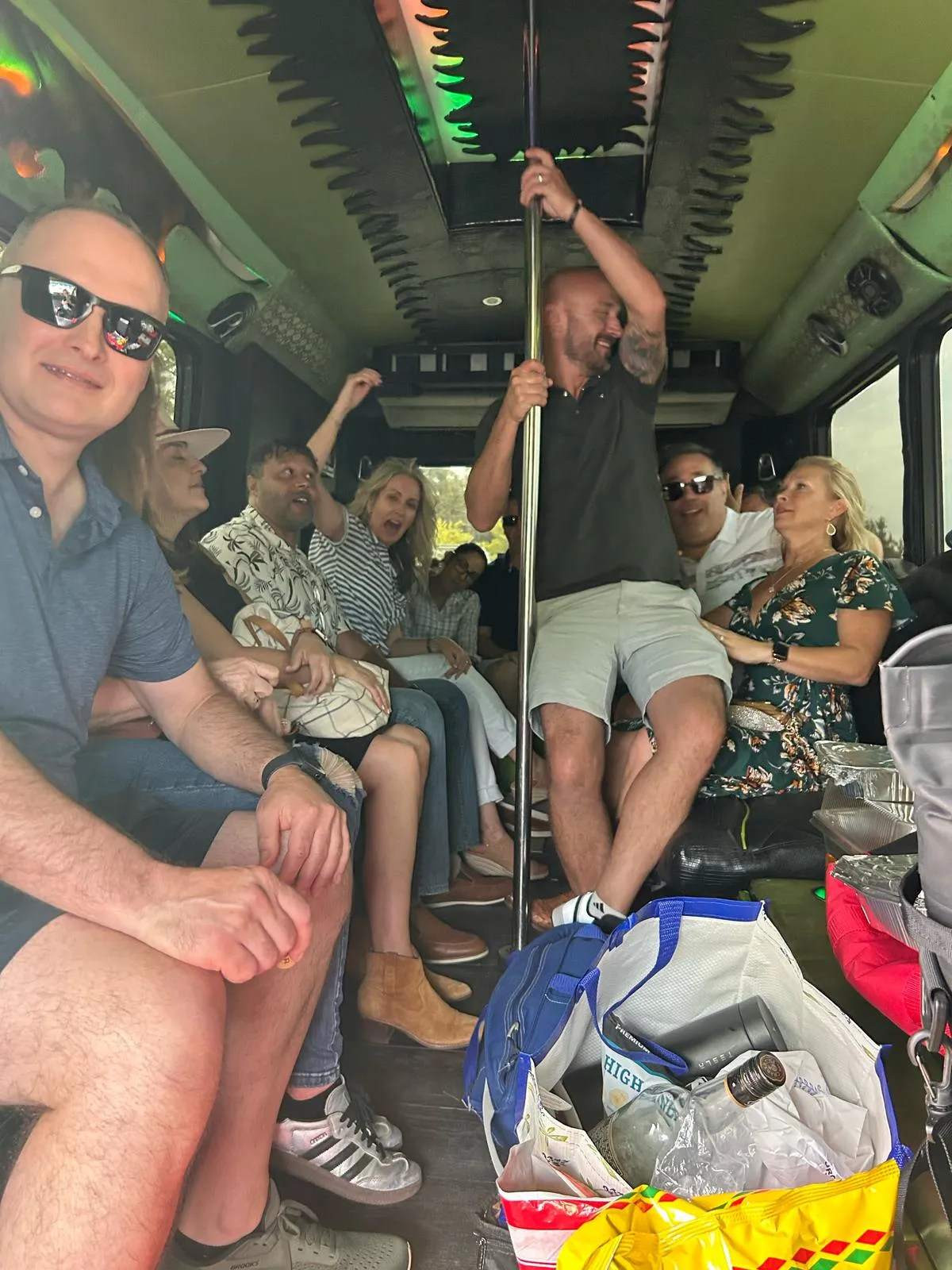 Group riding together on an Austin party bus on the way to a Hill Country day trip